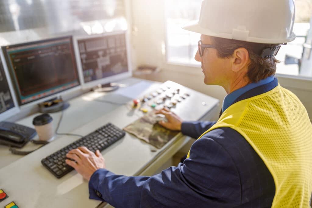 male worker using computers at manufacturing plant 2021 12 09 04 34 25 utc